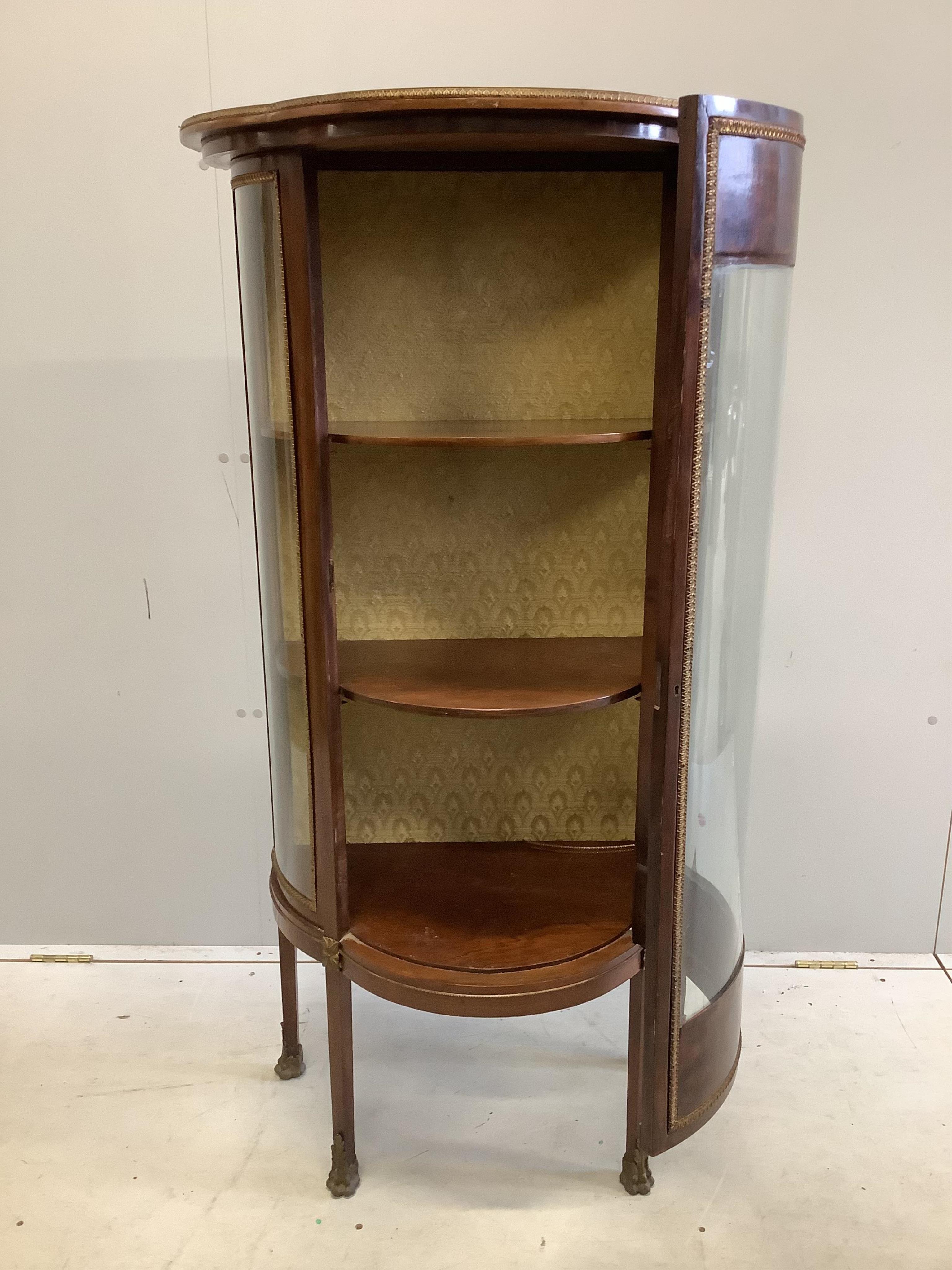 A Louis XVI style bowfront vitrine, width 69cm, depth 40cm, height 133cm. Condition - fair